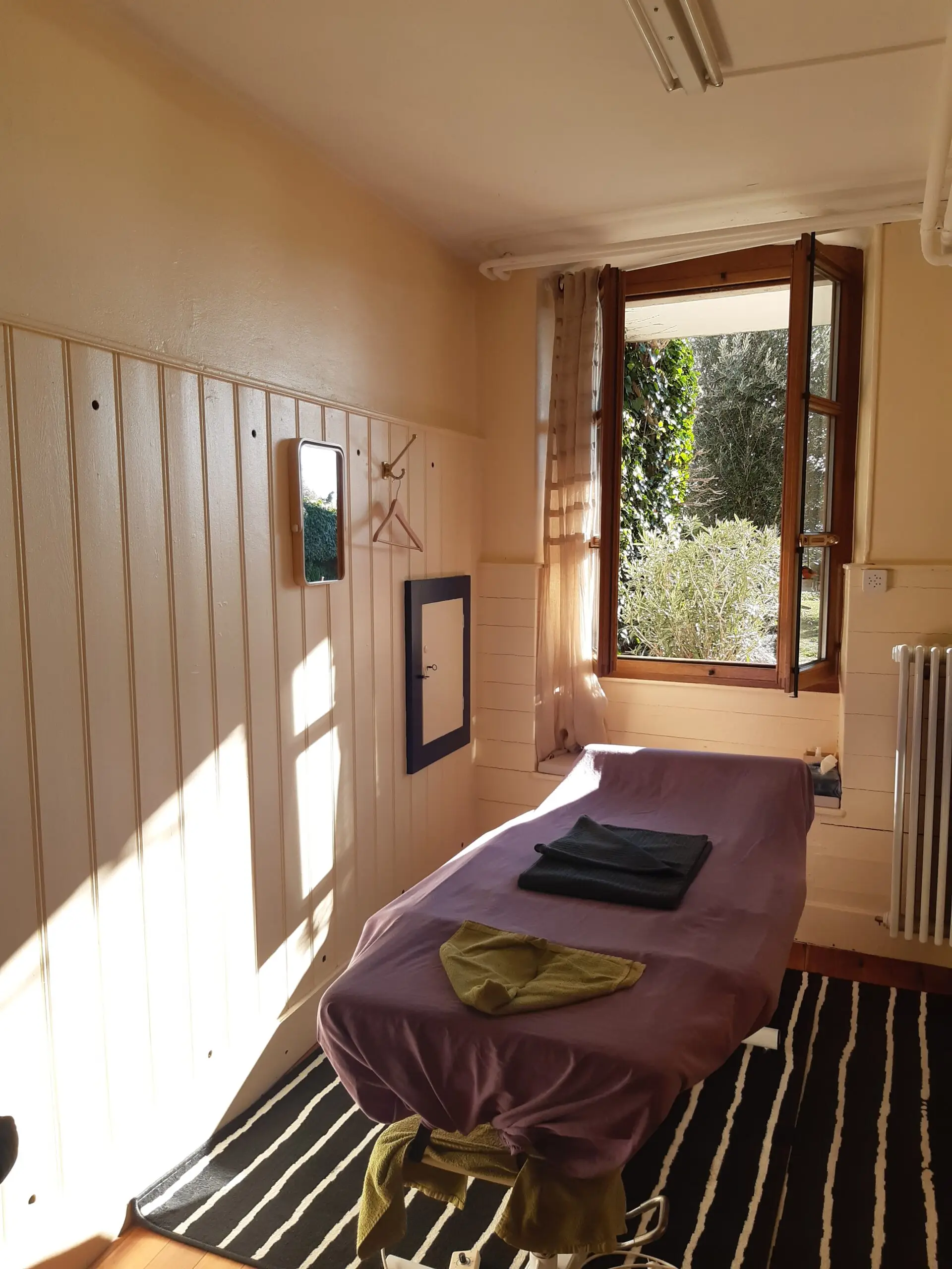 The light-filled massage room at Le Petit Coin Massages in Morges